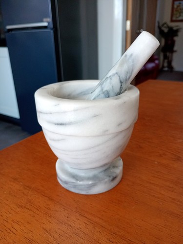 Marble pestle and mortar - and,